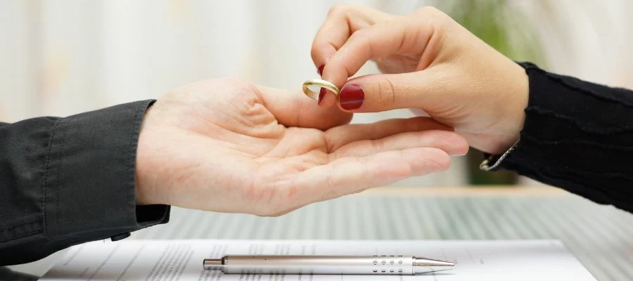 woman handing man a ring after a military divorce