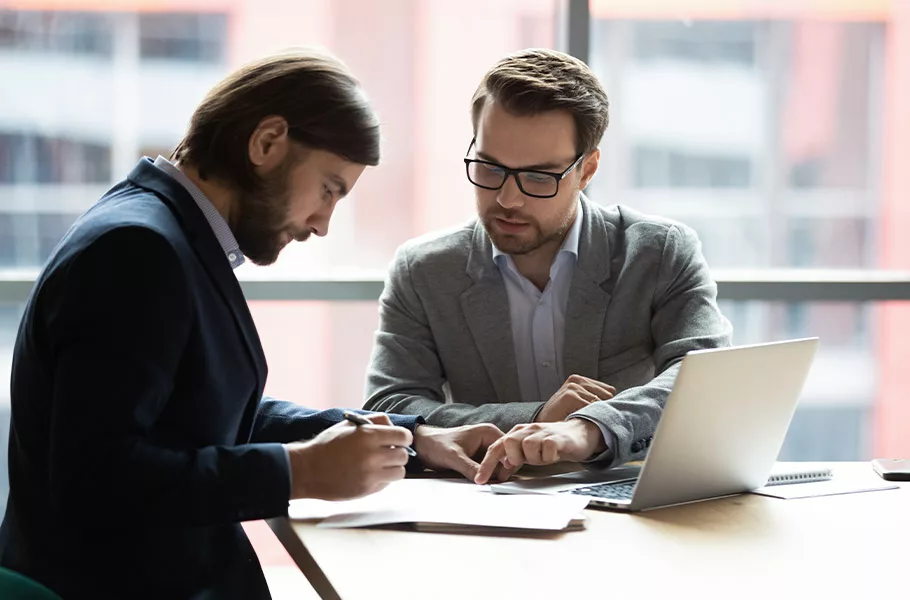 lawyer discussing paperwork with a client