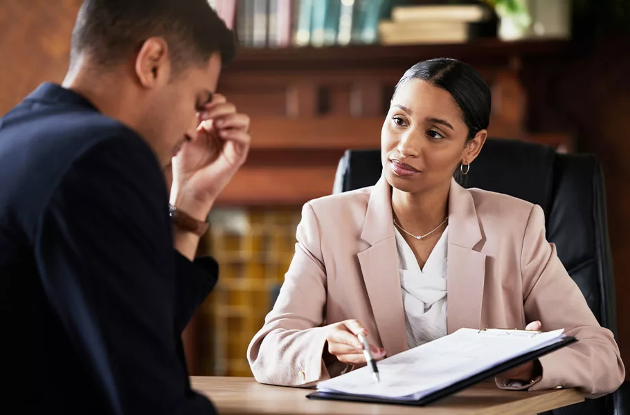 female lawyer sitting down with a client